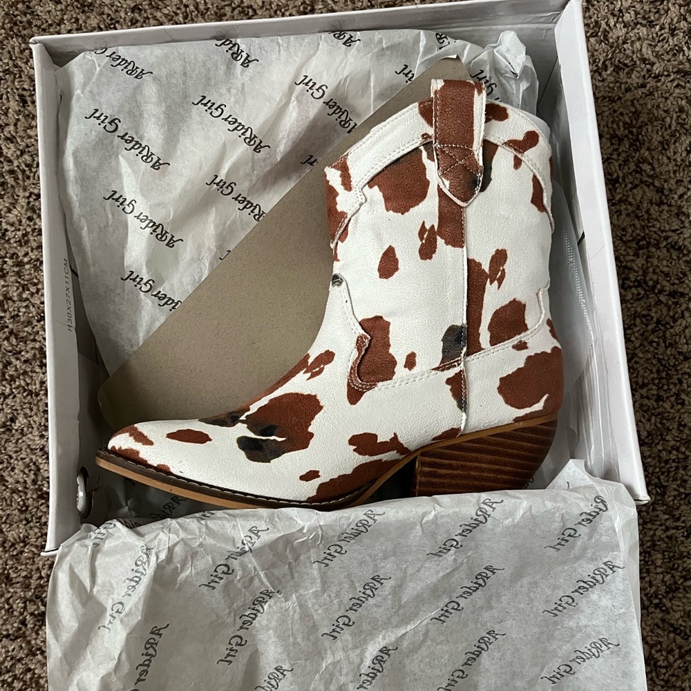Cow print cowboy boots